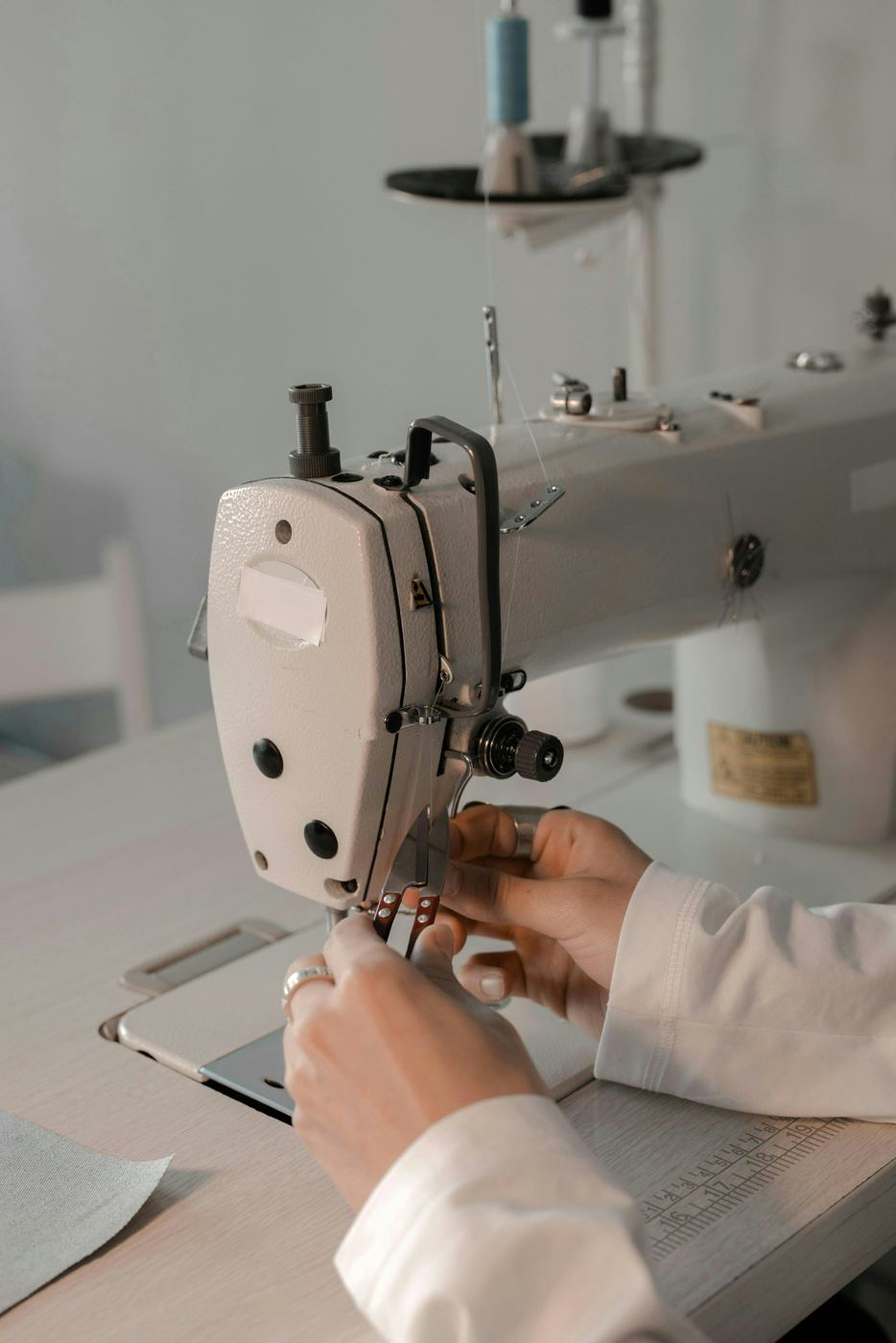 Hands at work on an industrial sewing machine